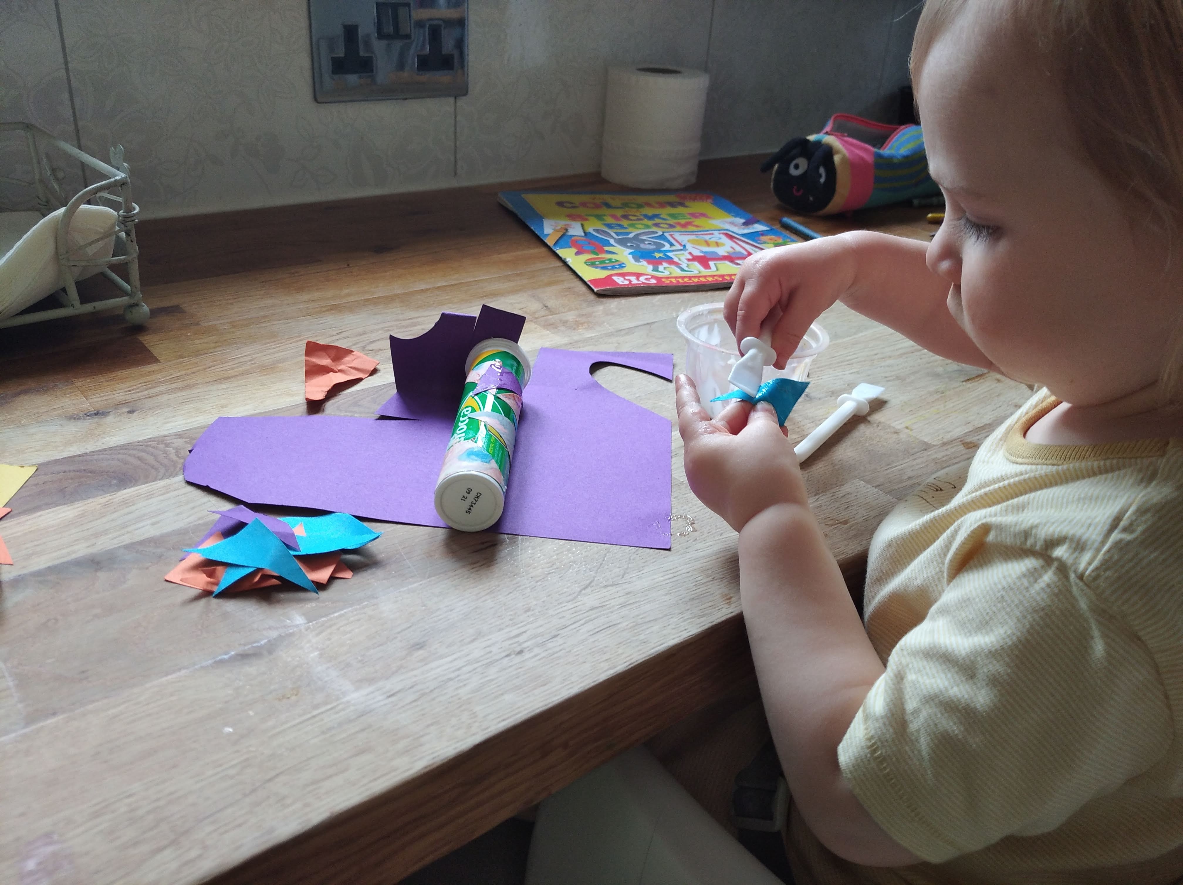 child making musical shaker